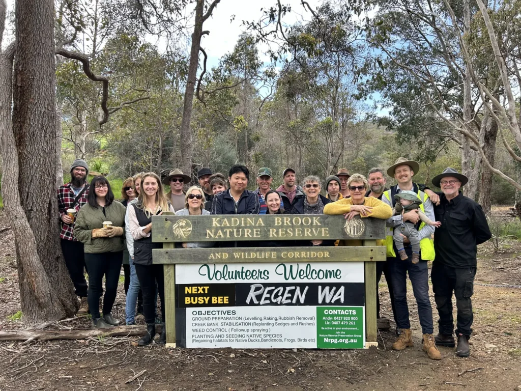 Group photo standing in behind the Kadina Brook Nature Reserve sign as part of the Make your Hectare Count project.
